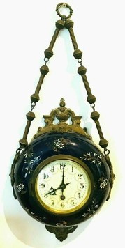  Enamelled earthenware wall clock 