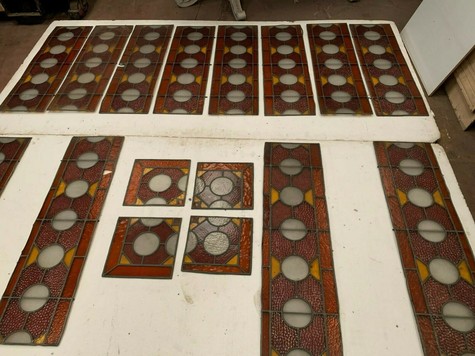  Fourteen stained glass decorative elements 