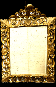 miroir doré à pare clause en bois sculptée ajourée miroir biseauté . XIX siècle.