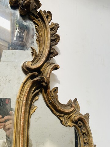 applique formant miroir à parcloses en bois sculpté doré. XIX siècle .