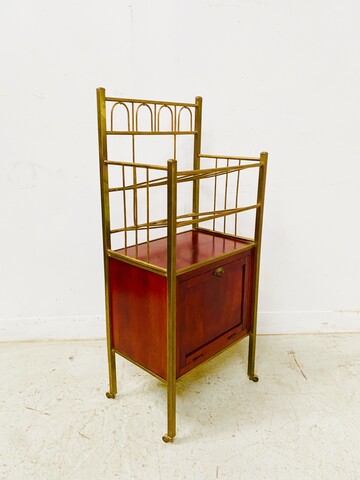 casier à musique formant bar en laiton et caisson en acajou vernis . XX siècle .