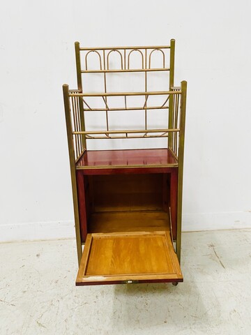 casier à musique formant bar en laiton et caisson en acajou vernis . XX siècle .