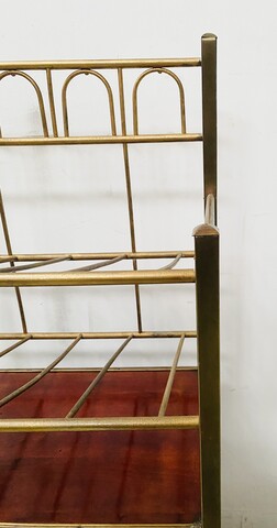 casier à musique formant bar en laiton et caisson en acajou vernis . XX siècle .