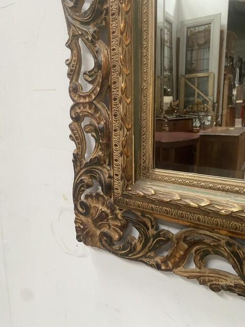 miroir circa 1950 à décor antique cadre bois doré . XX siècle .