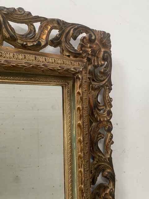 miroir circa 1950 à décor antique cadre bois doré . XX siècle .