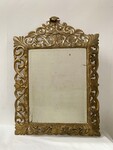 miroir doré à pare clause en bois sculptée ajourée miroir biseauté . XIX siècle.
