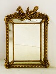 miroir doré à pare clause en bois stuqué doré miroir biseauté . XIX siècle.