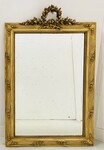 miroir Louis XVI patine dorée décor floral finement sculptée . XX siècle .