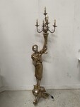 Nubiens formant lampadaire en bois argenté et or cinq éclairages .XX siècle.