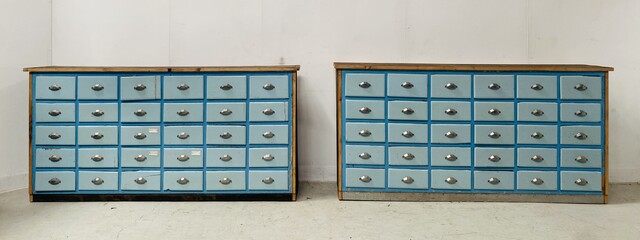 paire de meubles rangements trente tiroirs par meuble patiné . XX siècle .