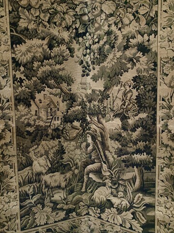 Paravent a quatre feuilles en tapisserie à décor de paysages animés .XX siècle.