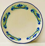 plat rond en faïence Italienne à décor floral à dominante bleu . XX siècle .