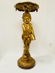 selette en bois sculpté et doré figurant un putto finement sculptée .XIX siècle.
