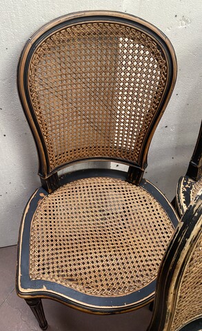 suite de huit chaises en bois patiné assises dossier cannage . XX siècle .