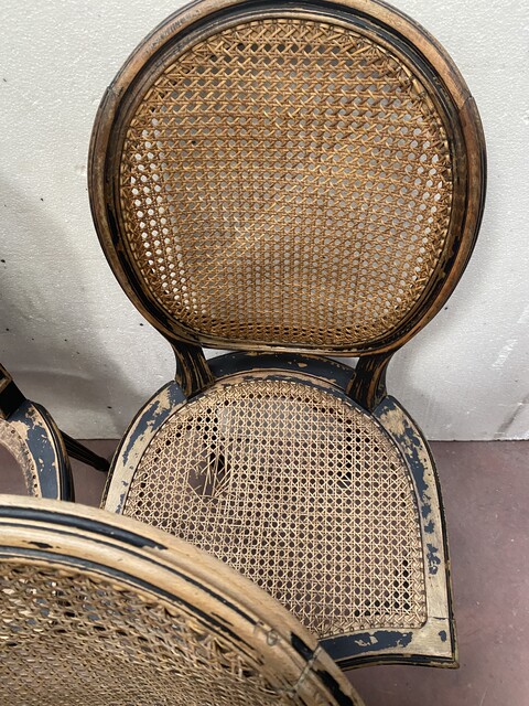 suite de huit chaises en bois patiné assises dossier cannage . XX siècle .