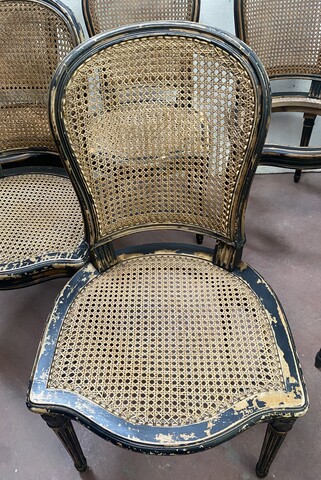 suite de huit chaises en bois patiné assises dossier cannage . XX siècle .