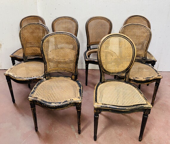suite de huit chaises en bois patiné assises dossier cannage . XX siècle .