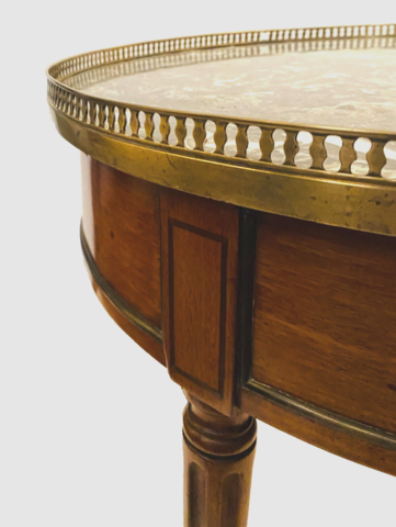 Table bouillote de style Louis XVI en acajou dessus marbre gris SA . XX siècle .