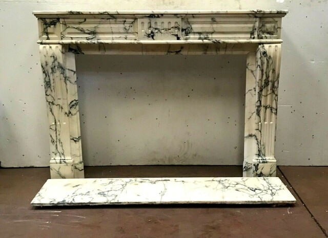  Vous en avez un à vendre ? Vendez le vôtre cheminée louis XVI à rehaut en marbre massif décor à cannelure . XIX siècle .